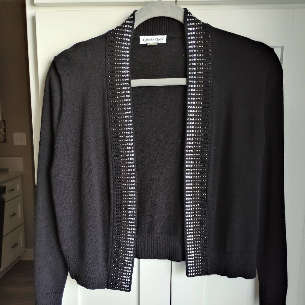 A black Calvin Klein cardigan embellished with crystal trim in a size small